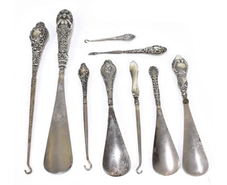 A collection of hallmarked silver mounted button hooks and shoe horns (8).