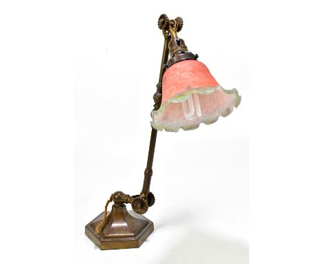 An early 20th century lacquered brass adjustable table lamp, with associated mottled glass shade on a hexagonal base, height 