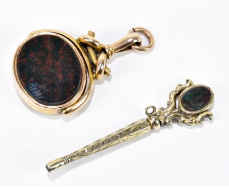 A 15ct yellow gold mounted swivel fob, set with hardstone, approx weight 16.9g, together with a yellow metal pocket watch key