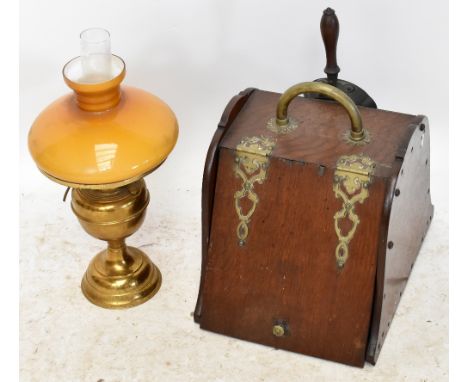An early 20th century oak brass bound coal scuttle, complete with shovel, also a brass oil lamp and shade (2).