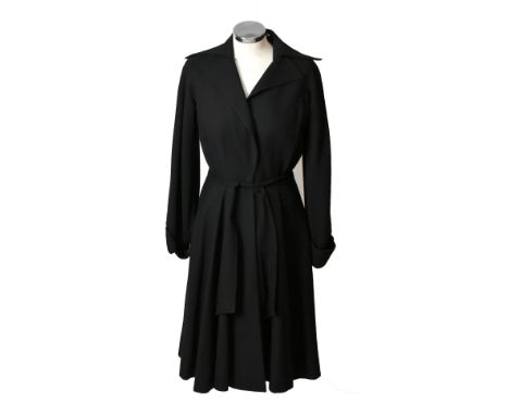 MADJEC, PARIS; a 1940s vintage 100% black wool coat dress with front covered buttons, long cuffed sleeves, side pockets, atta