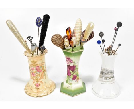 A large collection of assorted hatpins, of various designs, also four ceramic hatpin holders including a Shelley example 'Ye 
