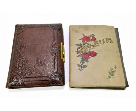 A postcard album, mainly early 20th century topographical, also some portrait and greetings cards and a photograph album with