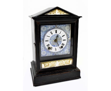 WINTERHALDER &amp; HOFMEIER; a Victorian ebonised mantel clock, with enamelled blue and white face with dial set with Roman n