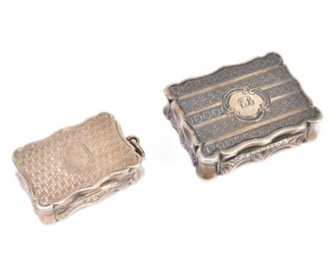 EDWARD SMITH; a Victorian hallmarked silver vinaigrette of shaped rectangular form with engine turned decoration, with gilded