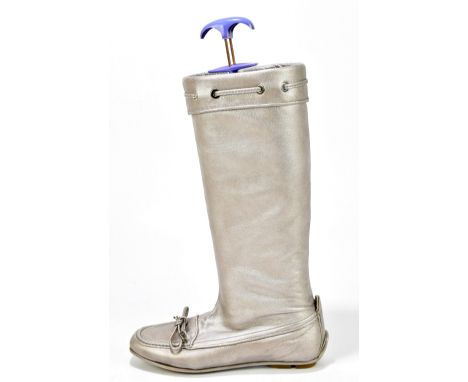 CHRISTIAN DIOR; a pair of soft calfskin silver metallic leather knee high boots, lined with soft leather, with draw string le