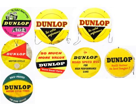 Eight vintage advertising circular card signs relating to motoring, including 'Dunlop - the Fastest, Fiercest Racing', diamet