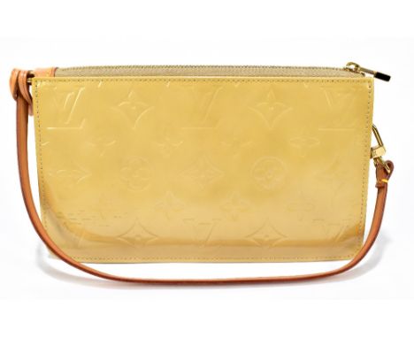 LOUIS VUITTON; a beige patent leather monogram 'Lexington' pouch handbag, with gold tone top zip and hardware and tan leather