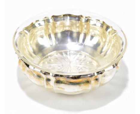 A German 925 grade silver bowl of shaped circular form, stamped Kaufmann 332246 with associated glass liner, diameter 18.5cm,