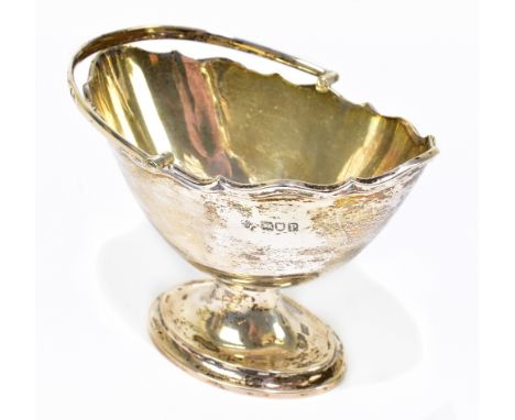 V &amp; CO; a George V hallmarked silver sugar bowl of oval form with swing handle, London 1910, approx weight 5.3ozt/166g.Ad