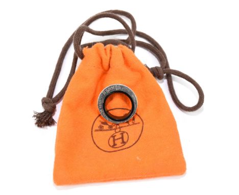 HERMÈS; a heavy silver ring with black ceramic insert, stamped 925 and 'Hermès', in authentic original dust bag.Additional In