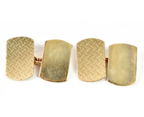 A pair of 9ct yellow gold cufflinks, each example with one panel and engine turned decoration, approx 4.6g.Additional Informa