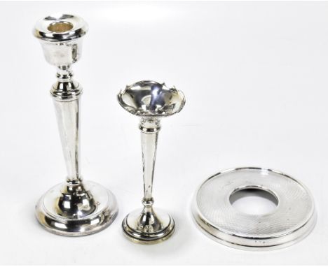 A George V hallmarked loaded silver posy vase, Birmingham 1915, height 16cm, a loaded hallmarked silver candlestick and a sil