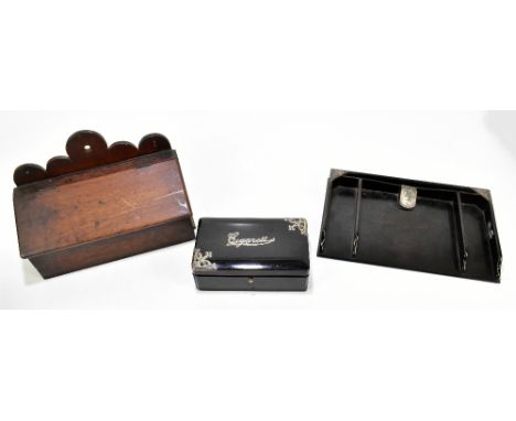 An ebony cigarette box with silver mounts, width 17.5cm (af), a coromandel silver mounted desk tidy, length 30cm, and a small
