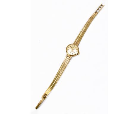 TISSOT; a lady's vintage 9ct yellow gold wristwatch with integral bracelet, length of bracelet approx 15cm, approx 14.7g.Addi