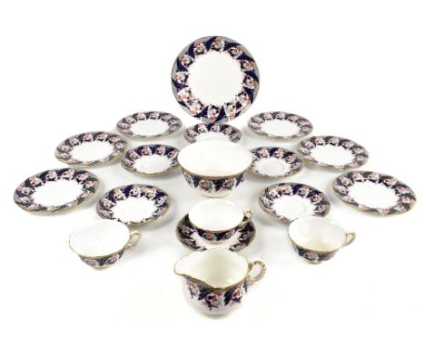 ROYAL WORCESTER; an eighteen piece part tea service in the Imari palette with floral decoration with gilt highlights.