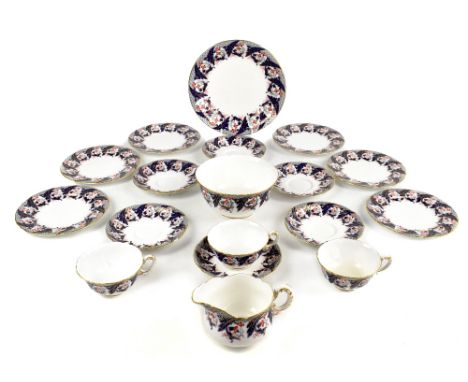 ROYAL WORCESTER; an eighteen piece part tea service in the Imari palette with floral decoration with gilt highlights.