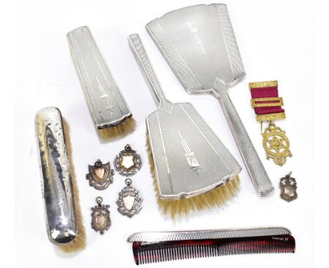 W.G SOUTHERS &amp; CO; a George VI hallmarked silver backed three piece dressing table set comprising mirror, hair brush and 