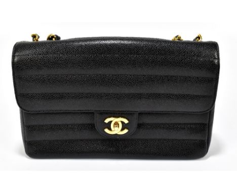 CHANEL; a vintage 1995 black caviar leather medium single flap 'Timeless Classic' handbag, with quilted horizontal lines, 24k