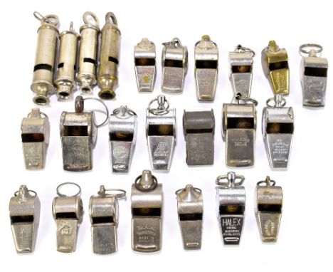 A collection of twenty-four vintage whistles including the Acme Scout Master whistle.