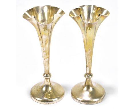 MAPPIN &amp; WEBB; a pair of Edward VII hallmarked silver posy vases with quatroform tops and cast beaded rims, London 1902, 