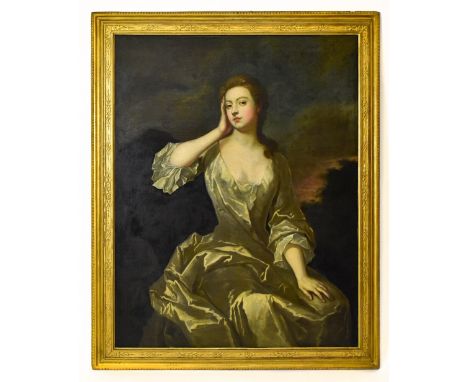 FOLLOWER OF SIR PETER LELY; a large oil on canvas, portrait study of a young woman with landscape beyond, unsigned, 128 x 100