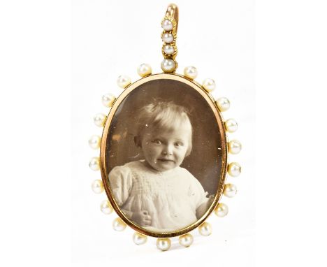 A yellow metal and seed pearl double sided locket pendant, length including bail 50mm, approx 9.4g.Additional InformationNo p