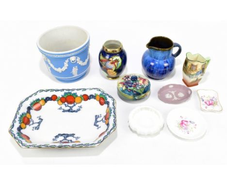 WALTER MOORCROFT; a powder bowl and cover decorated in the 'Spring Flowers' pattern, together with further ceramics including