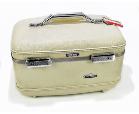 AMERICAN TOURISTER; a tiara cream vintage vanity case with a hard shell exterior, original working locks with four keys, logo