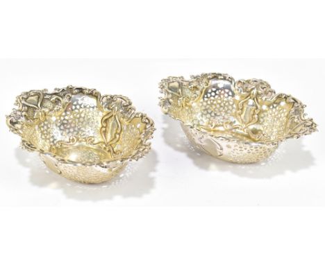 CHARLES COOKE; a pair of Edward VII hallmarked silver bonbon dishes of oval form, with cast Art Nouveau style decoration and 