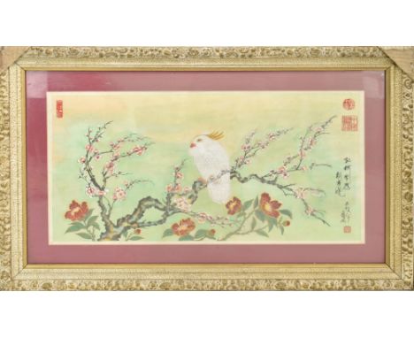 A 19th century Chinese watercolour on silk depicting a cockatoo amongst blossoming branches, with Chinese script and four red