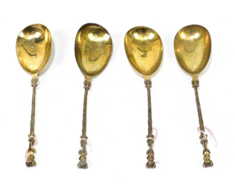 JOHN ALDWINKLE &amp; THOMAS SLATER; a pair of Victorian hallmarked silver gilt apostle spoons, with cast figural heads to fin