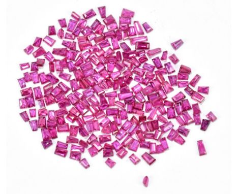RUBY; a group of tapering baguette stones totalling 10.34ct.