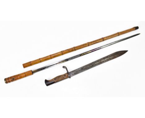 A late 19th century bamboo swordstick, the silvered blade with chased and floral decoration, length 87cm, together with an Im
