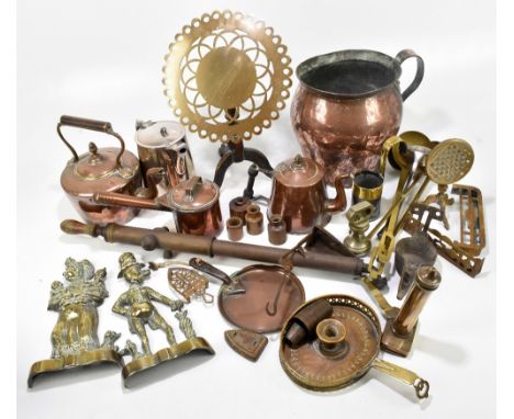 A quantity of copper and brass including a pair of door stops, copper kettle, trivet, rose sprayer, hearth ornaments, etc.