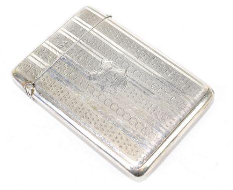 MANCHESTER/SALFORD INTEREST; a George V hallmarked silver card case with engine turned decoration surrounding a shaped cartou