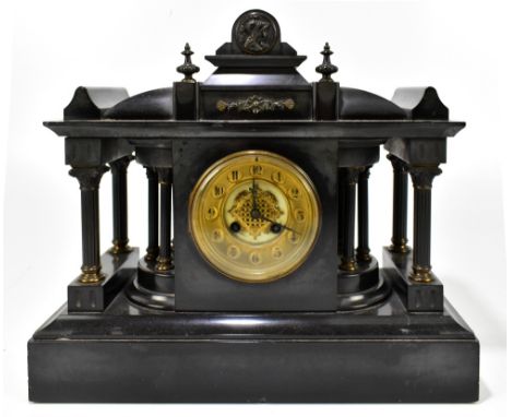 A Victorian French black slate mantel clock with circular dial set with Arabic numerals, width 40cm.