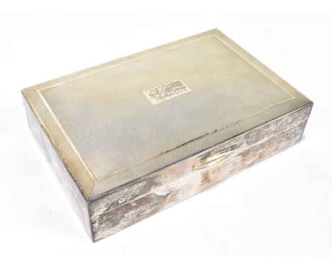 SANDERS &amp; MACKENZIE; an Elizabeth II hallmarked silver cigarette box of rectangular form with engine turned decoration to