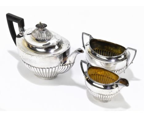 W &amp; G SISSONS; a Victorian hallmarked silver three piece tea service with gadrooned decoration to the lower body, London 