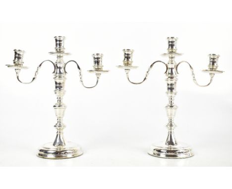 J.C CHATTERLEY &amp; SONS LTD; a pair of Elizabeth II hallmarked silver three branch candelabra, London 1972, height 28cm (we