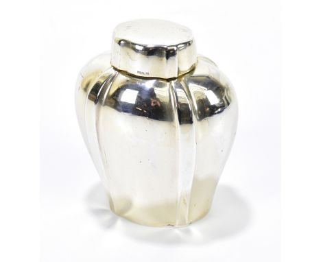 A sterling silver tea caddy of oval form with simple lift off cap, stamped A4575 to base, height 10.25cm, 4.35ozt/136g.