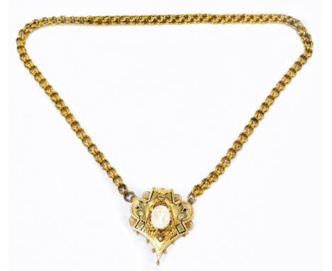 A Victorian yellow metal necklace, the openwork chain supporting a shaped pendant with traces of black enamel, central cameo 