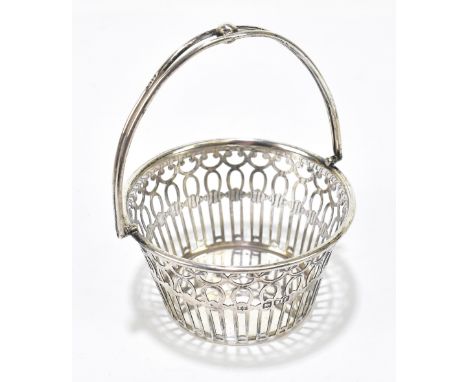 ROBERT PRINGLE; a Edward VII hallmarked silver swing handled basket of circular from with pierced decoration, London 1901, ap