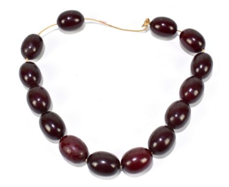 A cherry amber beaded necklace, length of each bead approx 2.5cm, approx 161g.Additional InformationThe string looks to be a 