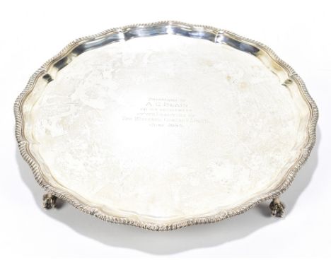 THOMAS BRADBURY &amp; SONS; a late Victorian hallmarked silver salver of shaped circular form with presentation inscription a
