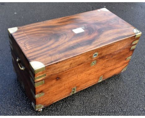 An early 20th century &nbsp;brass bound camphor wood trunk, with brass handles, raised on later castors, width 96cm, depth 48