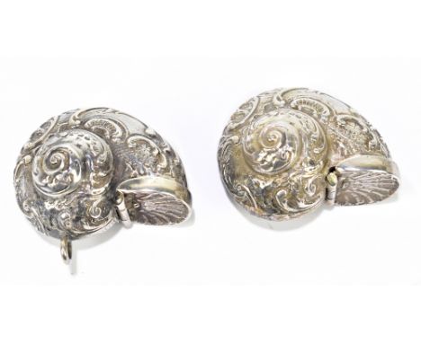 Two similar Elizabeth II hallmarked silver snuff boxes in the form of nautilus shells with simple hinged covers, Birmingham 1