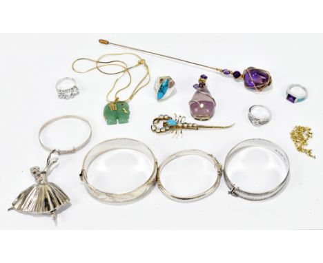 A group of costume jewellery including three silver bracelets, a jade elephant pendant, scorpion pin, etc.