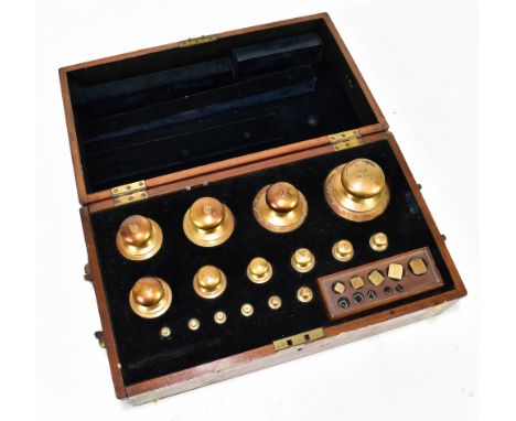 A burr walnut veneered and mahogany cased set of late 19th century weights, from 0.1g to 100ozt, with applied brass plaque 'C