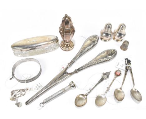 A collection of hallmarked silver including an Elizabeth II cigar cutter with engine turned decoration, a pepperette, a thimb